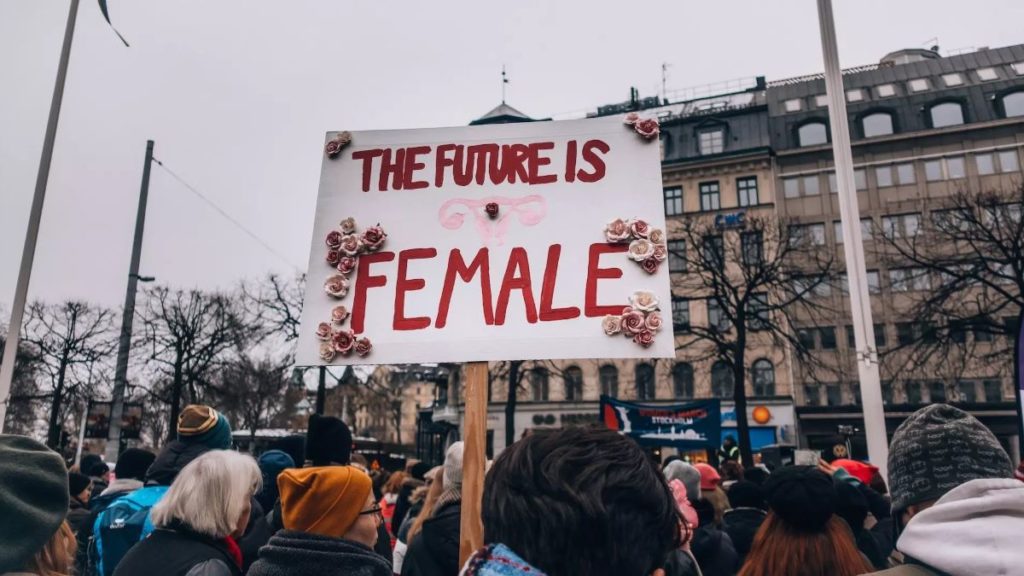 A sign reading The Future Is Female, birmingham women