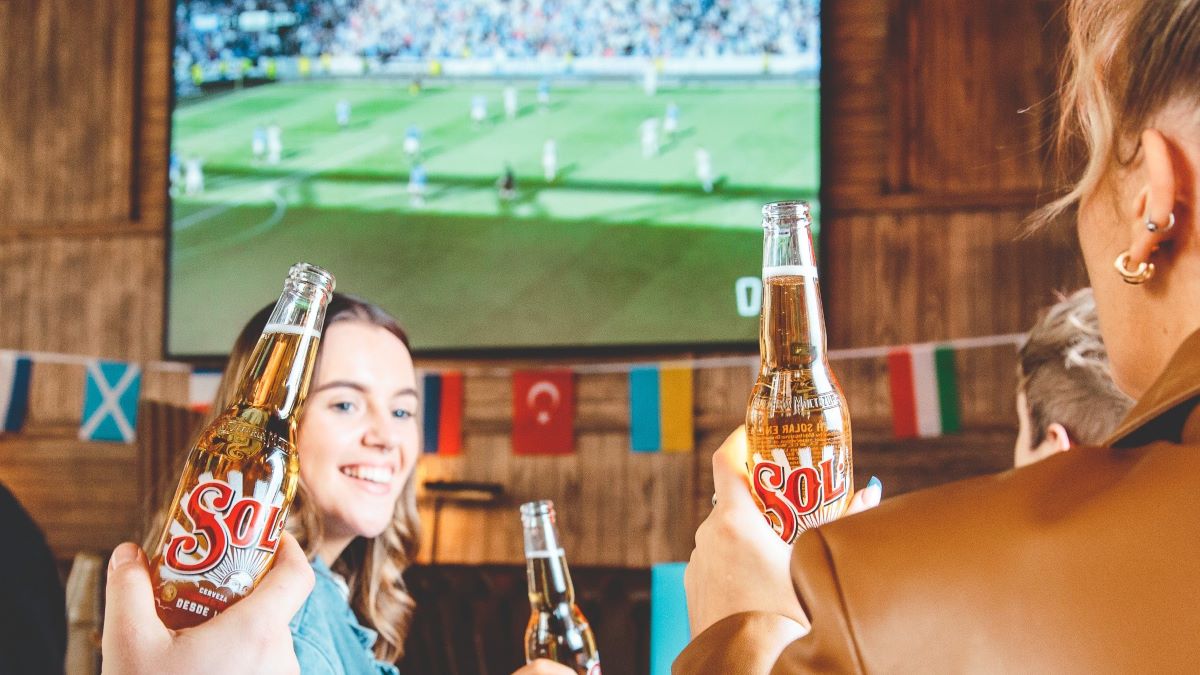 Women drinking beer and watching football at new sports bar BOX , one of the best things to do this June in Birmingham