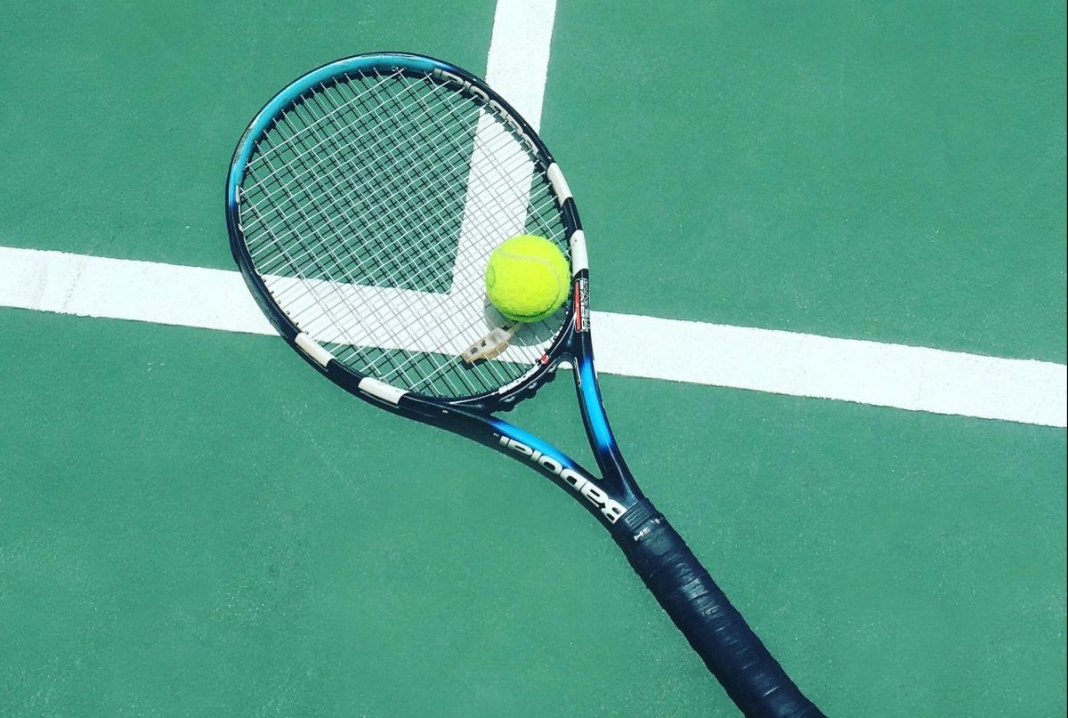 tennis-racquet-ball-on-court