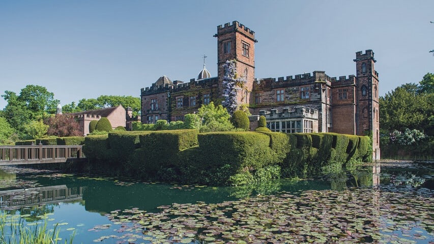 The manor grounds of New Hall Hotel & Spa surrounded by a moat