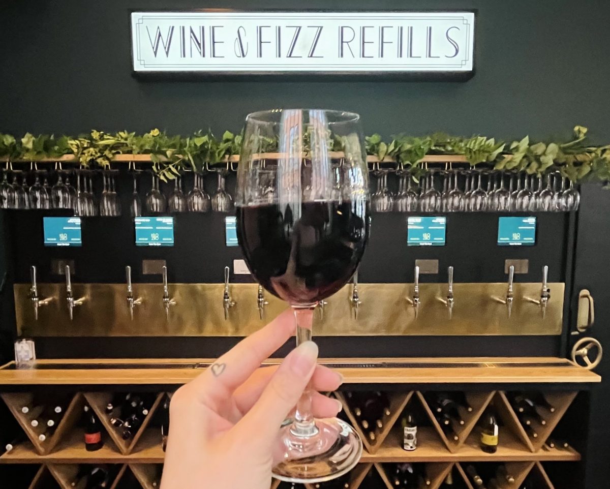 kilo-ziro-bar-wine-refill-station-glass-of-wine-in-hand