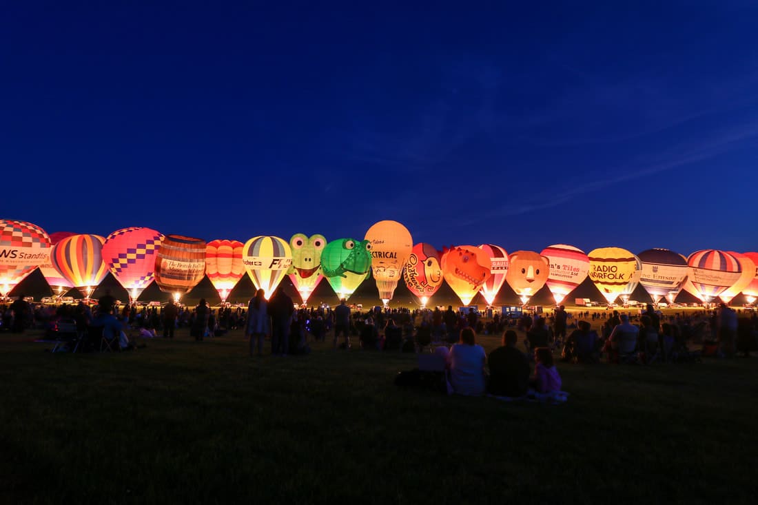 midlands-air-festival-part-of-jubilee-events-near-birmingham-row-of-glowing-hot-air-balloons