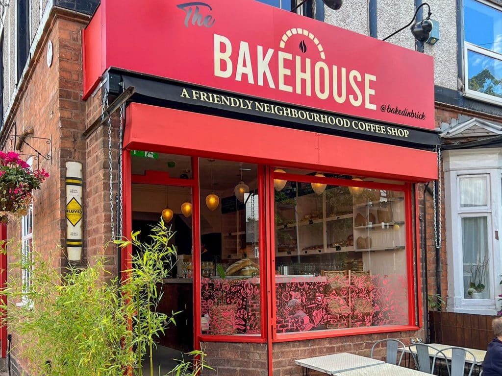 Red shopfront of Bakehouse by Baked in Brick