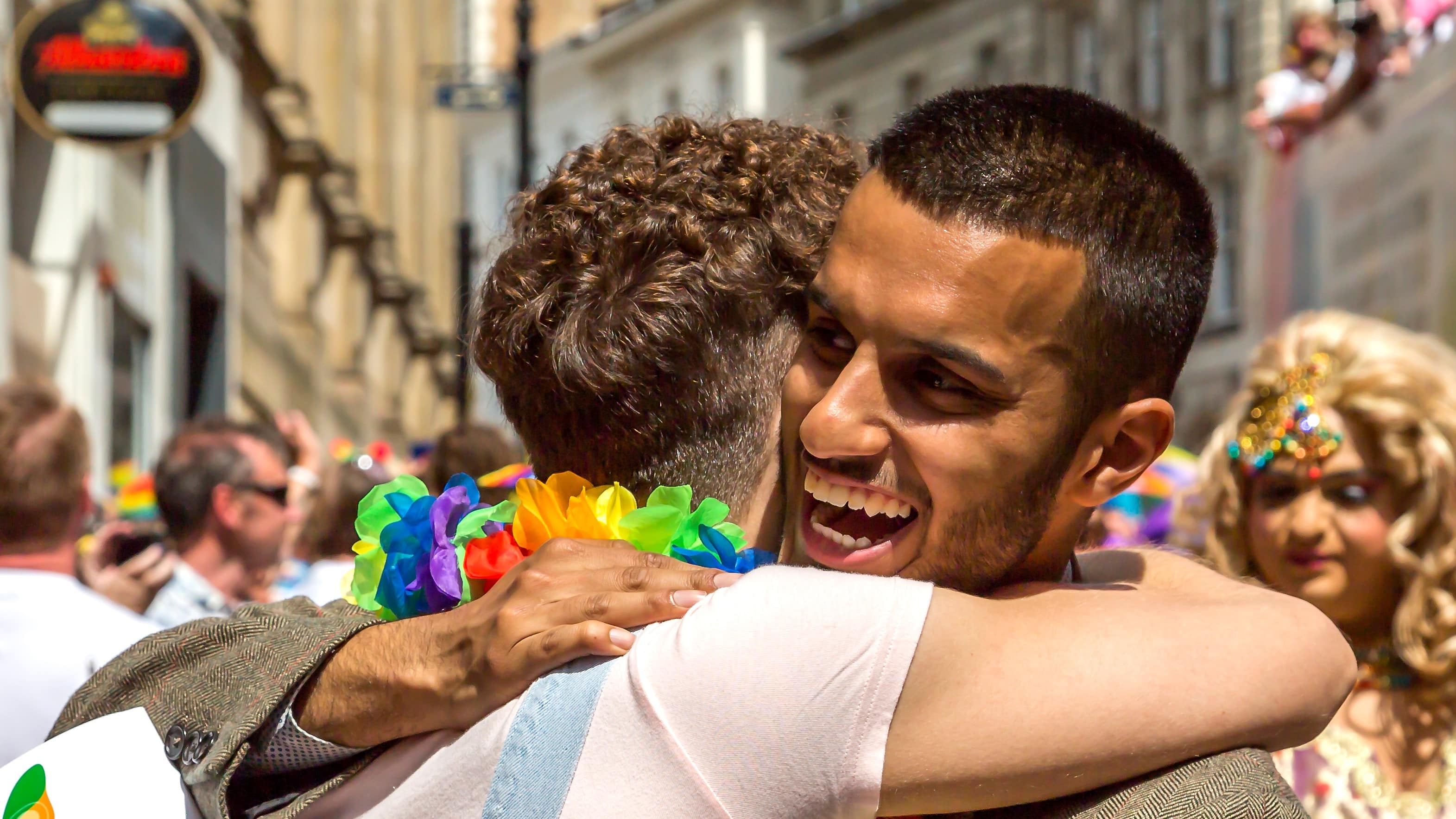 Two men show delight as they hug each other during the Birmingham Pride celebrations in Birmingham City centre.