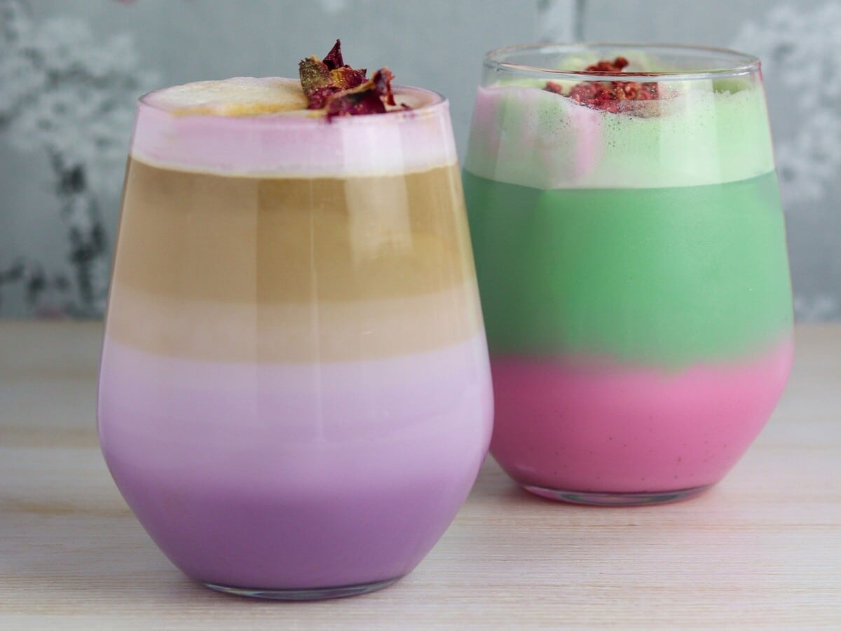 Two rainbow coloured lattes from Cocoa by Ali