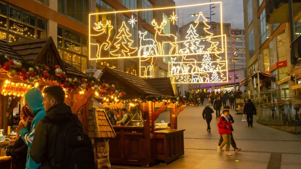 People shop at stalls at the Frankfurt Christmas Markets in Birmingham