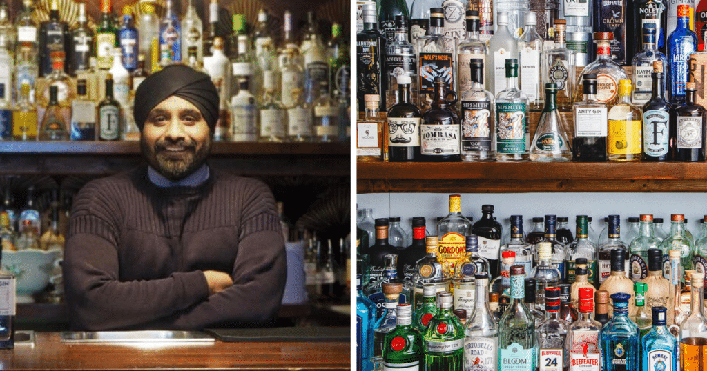 Aman, owner of 40 st Paul's stood in front of a wall of spirits