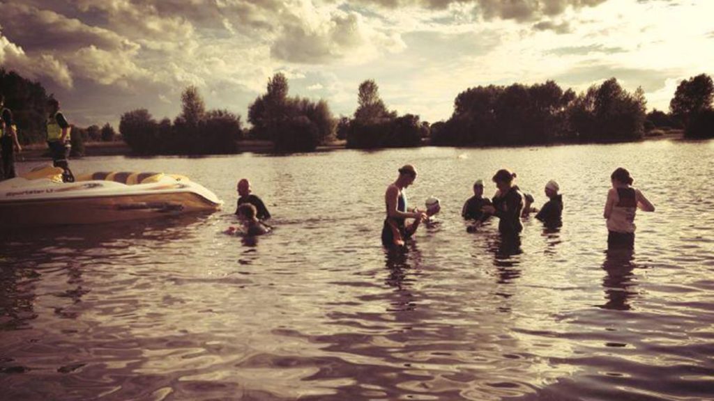 A group of people in Midlands Open Water going outdoor swimming near Birmingham