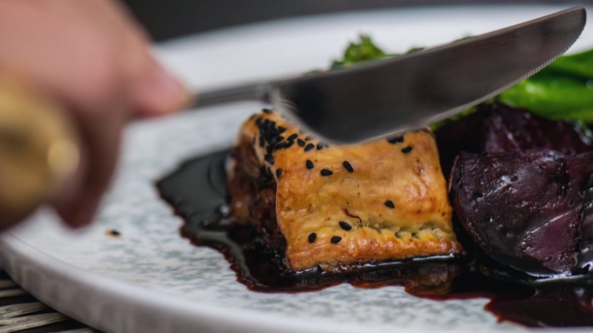 A sausage roll on a plate at Michelin Guide approved, Larder