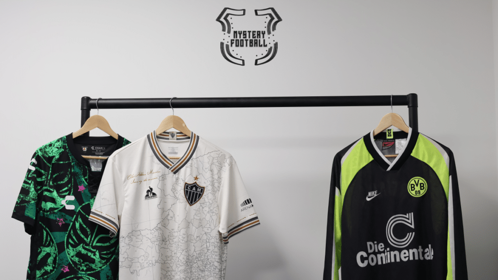 Left to right, 2021-22 Special Edition ‘Lucha Libra’ Club Leon Shirt from Mexico, 2021 Atletico Miniero Special Edition Manto Da Massa 113 Shirt, 1996 Borussia Dortmund Away Shirt. Mystery Football