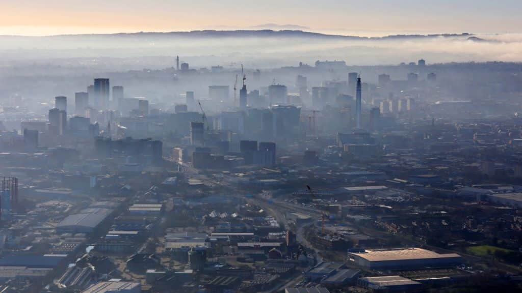 aerial view of a misty Birmingham skyline, UK