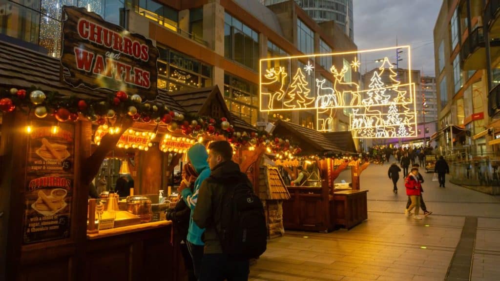 Birmingham, UK - December 2, 2019: People shop at stalls at the Birmingham Frankfurt Christmas Market.